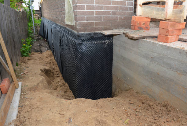 Happy homeowners after waterproofing job in Livingston